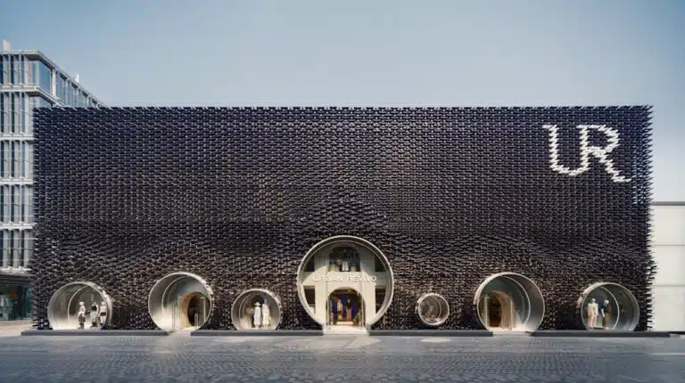 Dark lattice storefront with six circular entrances and a large UR logo; Urban Revivo retail store.